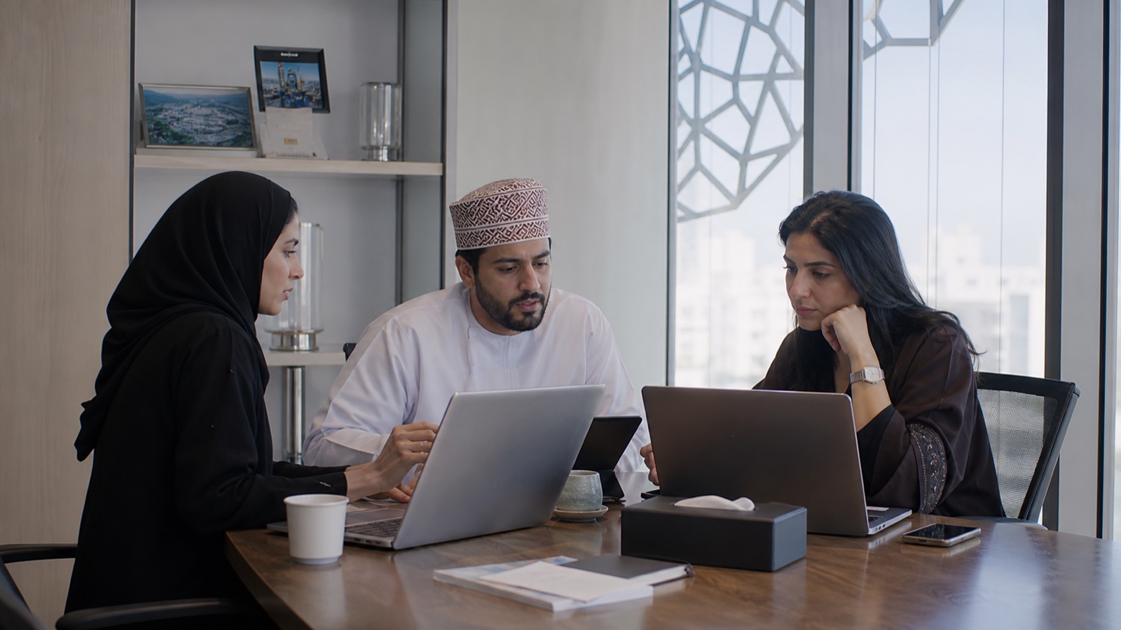 Oman content team reviewing company visibility across AI-assisted search