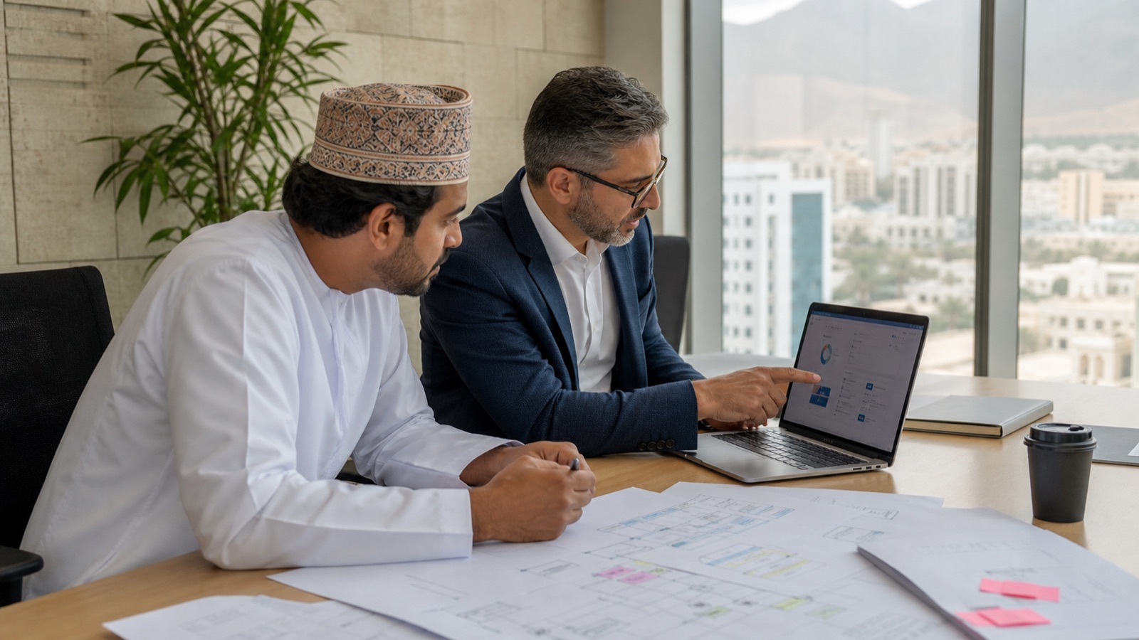 Oman business professionals working on Custom Software vs SaaS for Oman Businesses