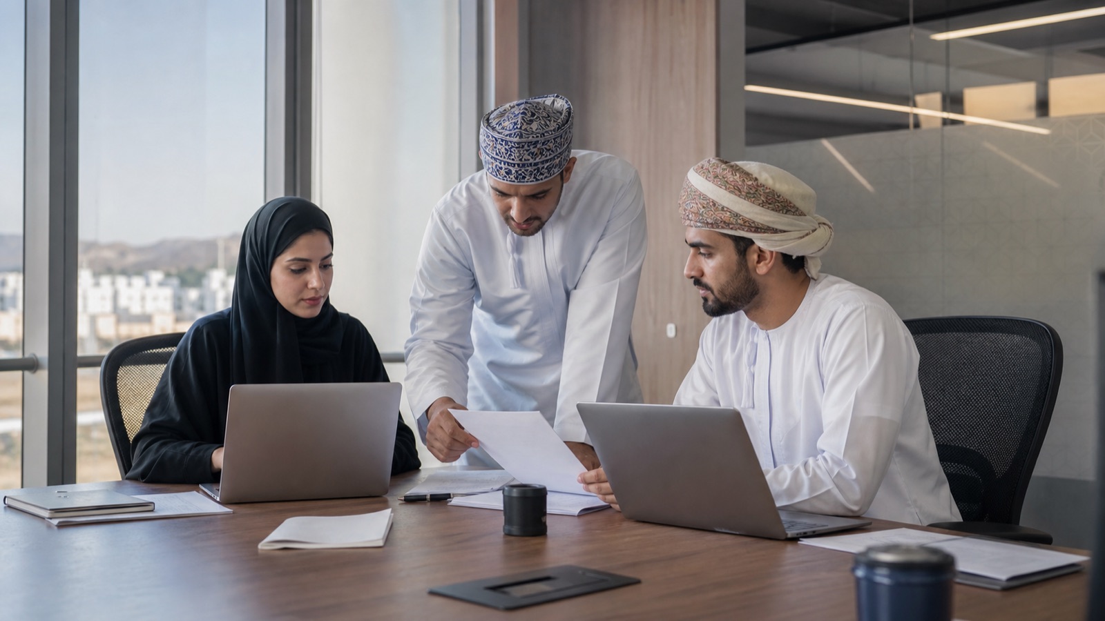 Oman technology team reviewing consistent company entity information