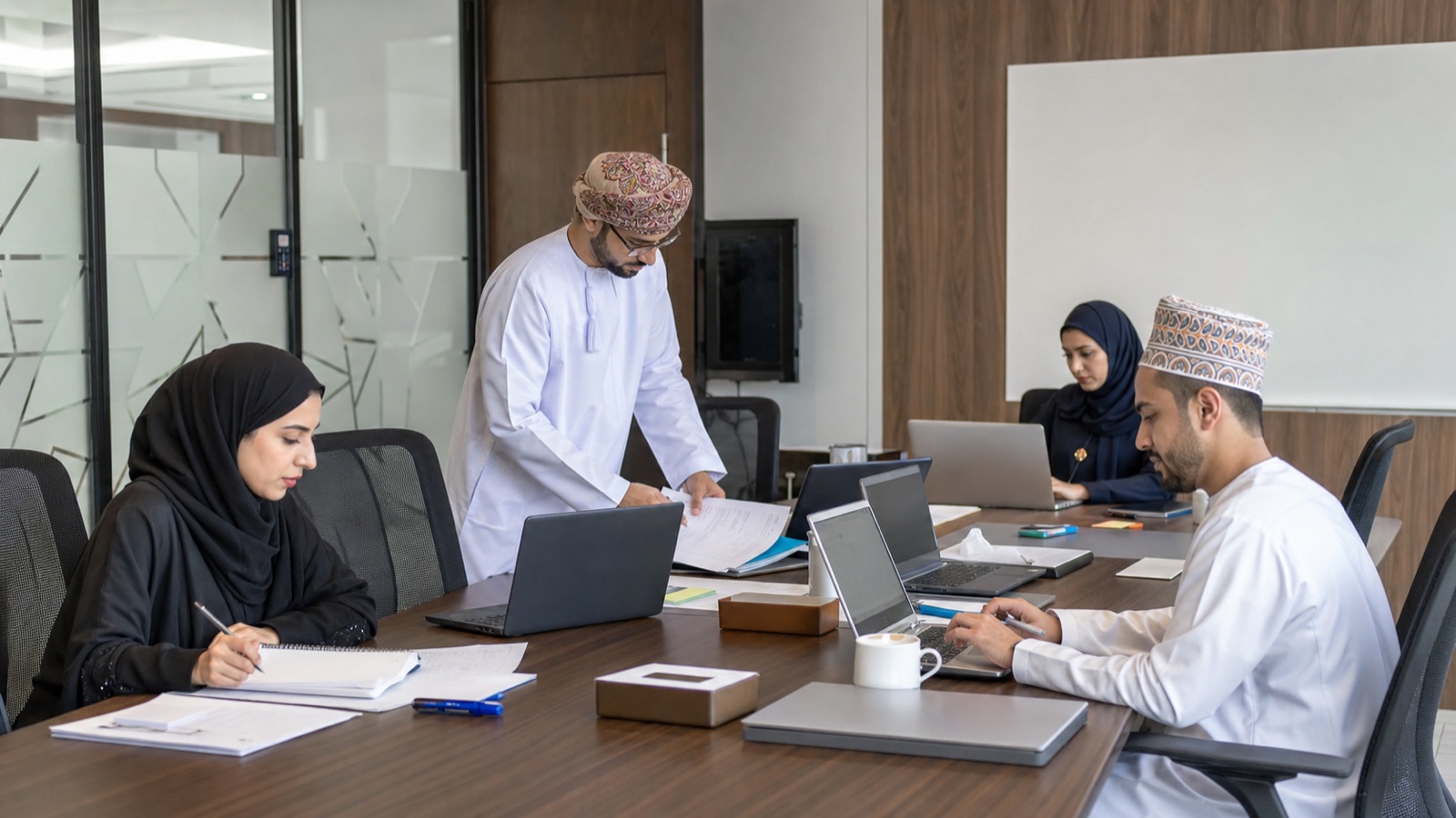 Oman business professionals working on Microsoft 365 Migration Checklist for Oman Businesses