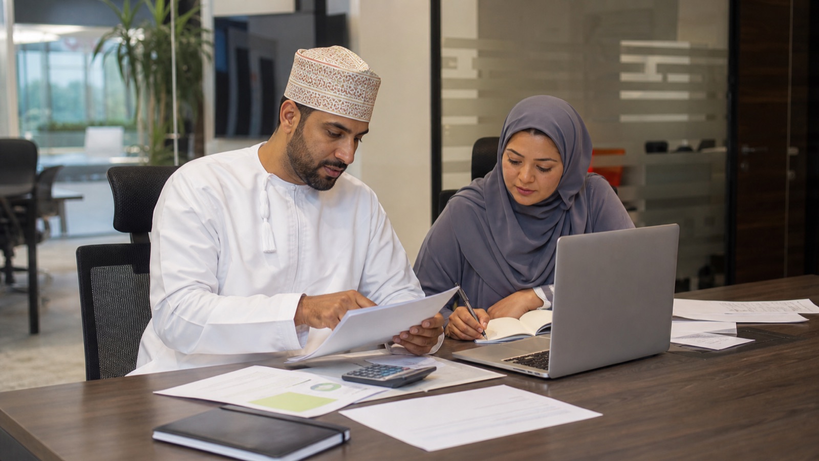 Oman business professionals working on Oman E-Invoicing: Fawtara Readiness Checklist