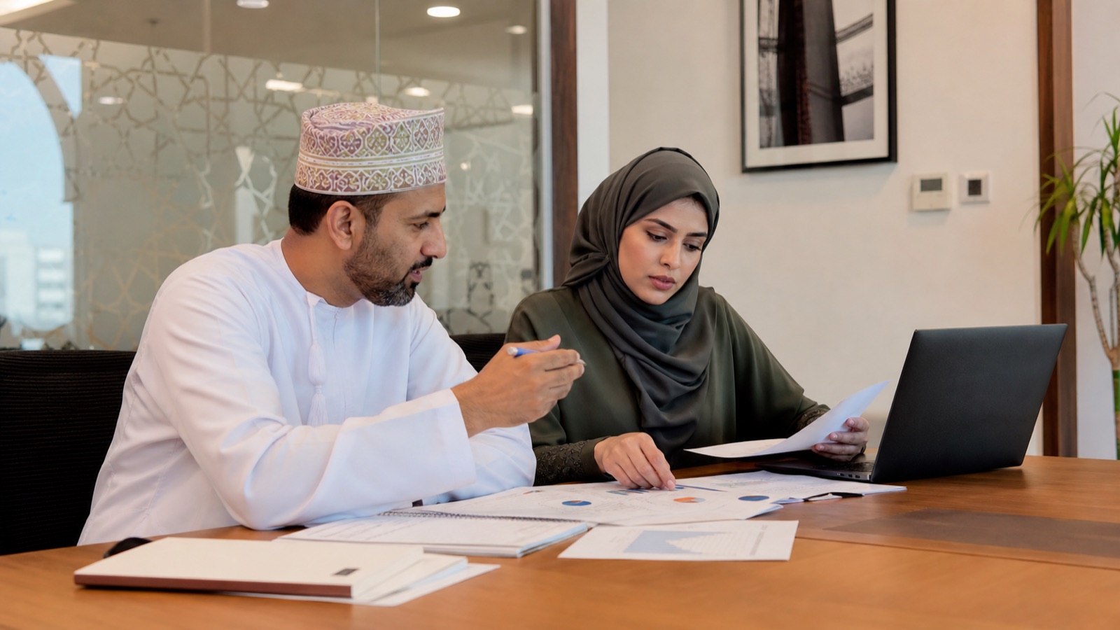 Omani project team reviewing delivery progress and project profitability