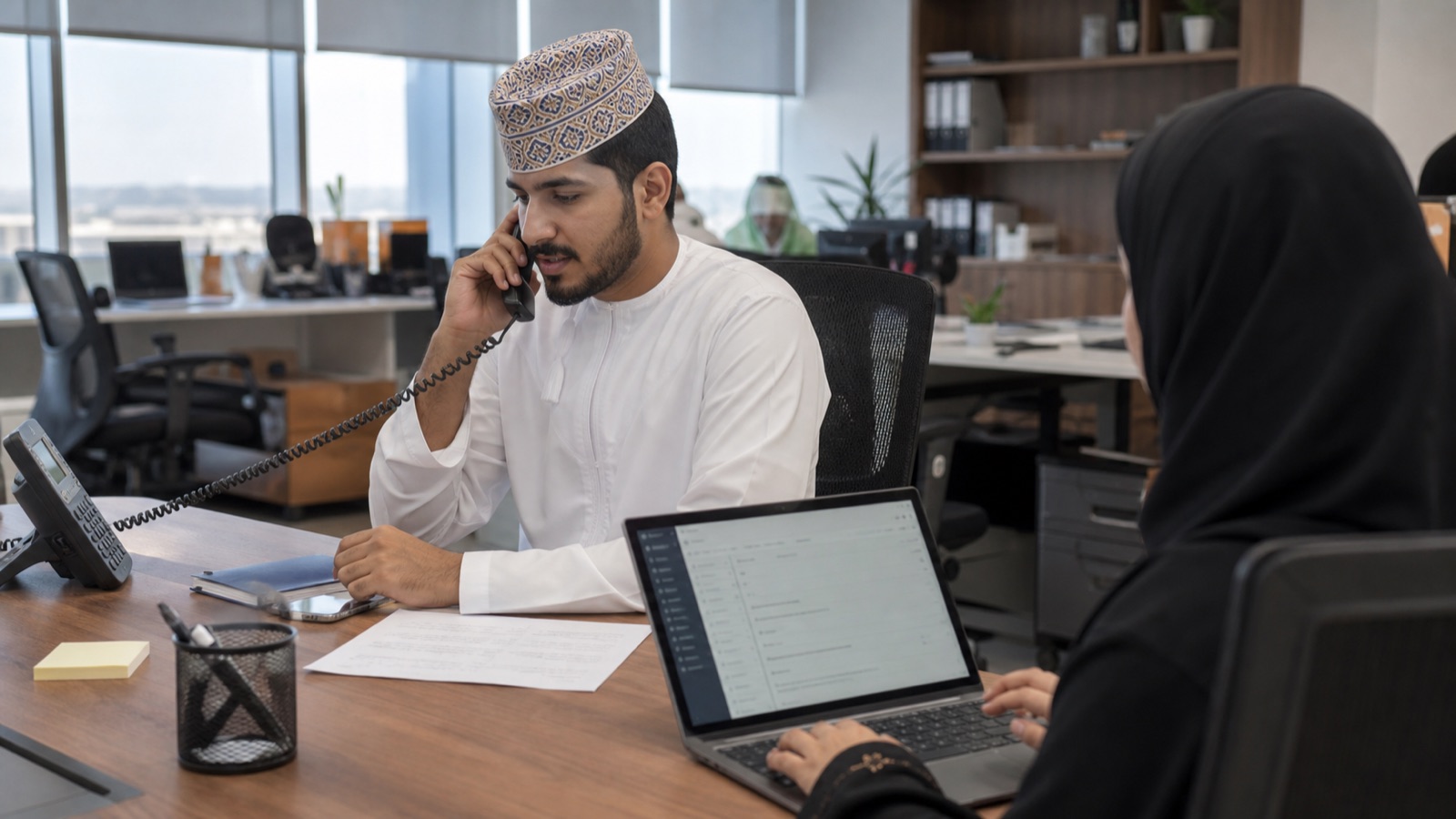 Oman business professionals working on WhatsApp Lead Capture and CRM Integration Guide